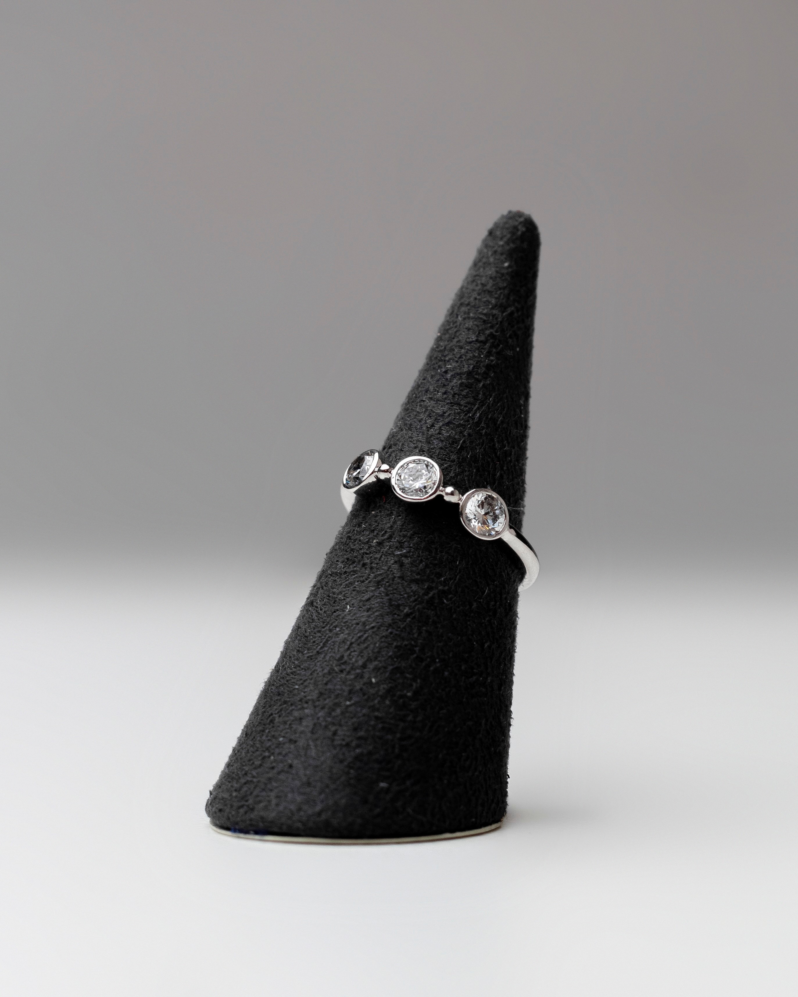 Sebaga ring on black display stand